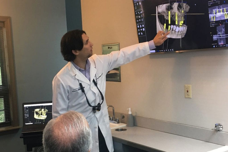 dr-rodriguez-discussing-dental implants placement
